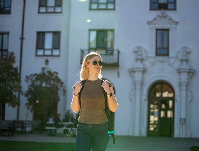 A student walking on campus 